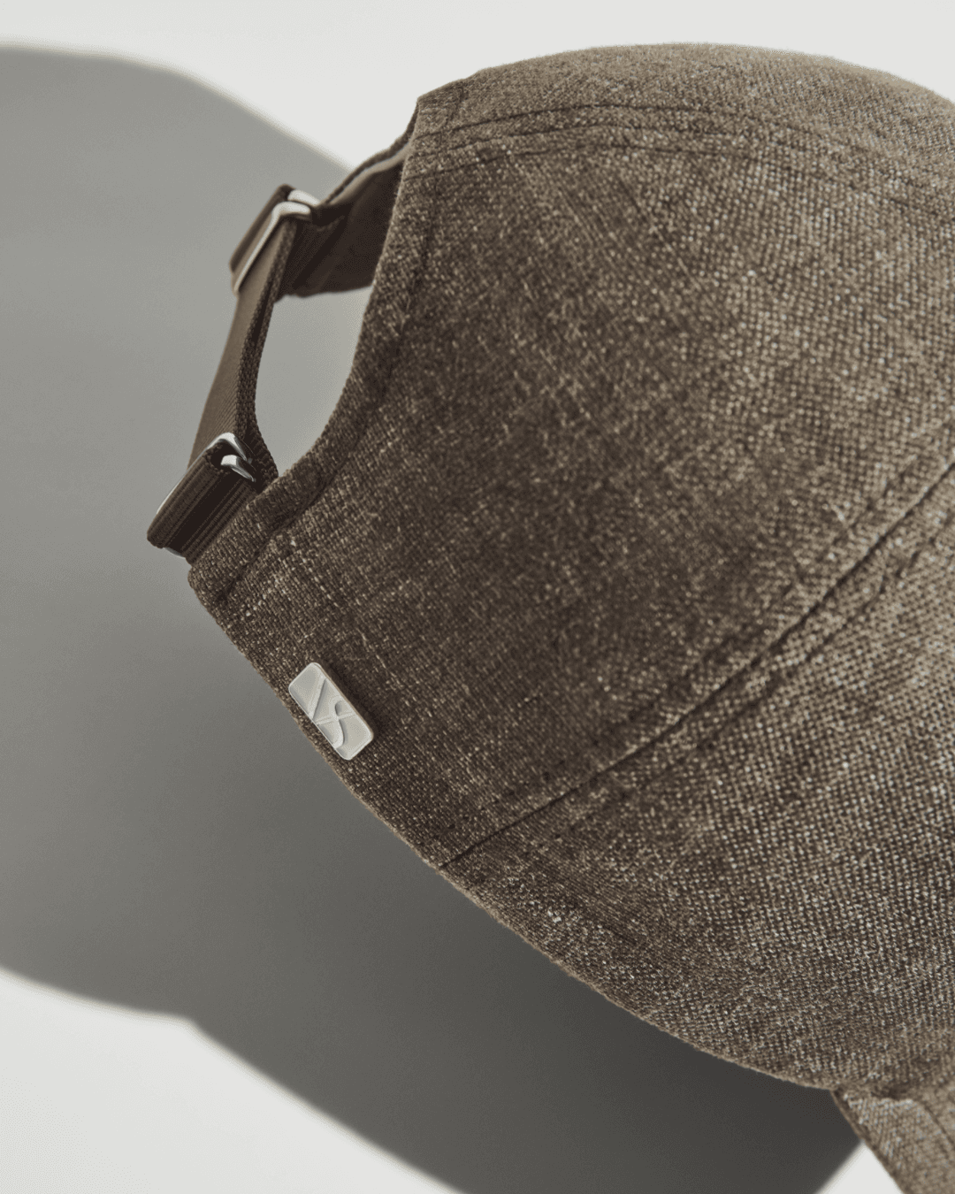 Back view of dark brown linen cap