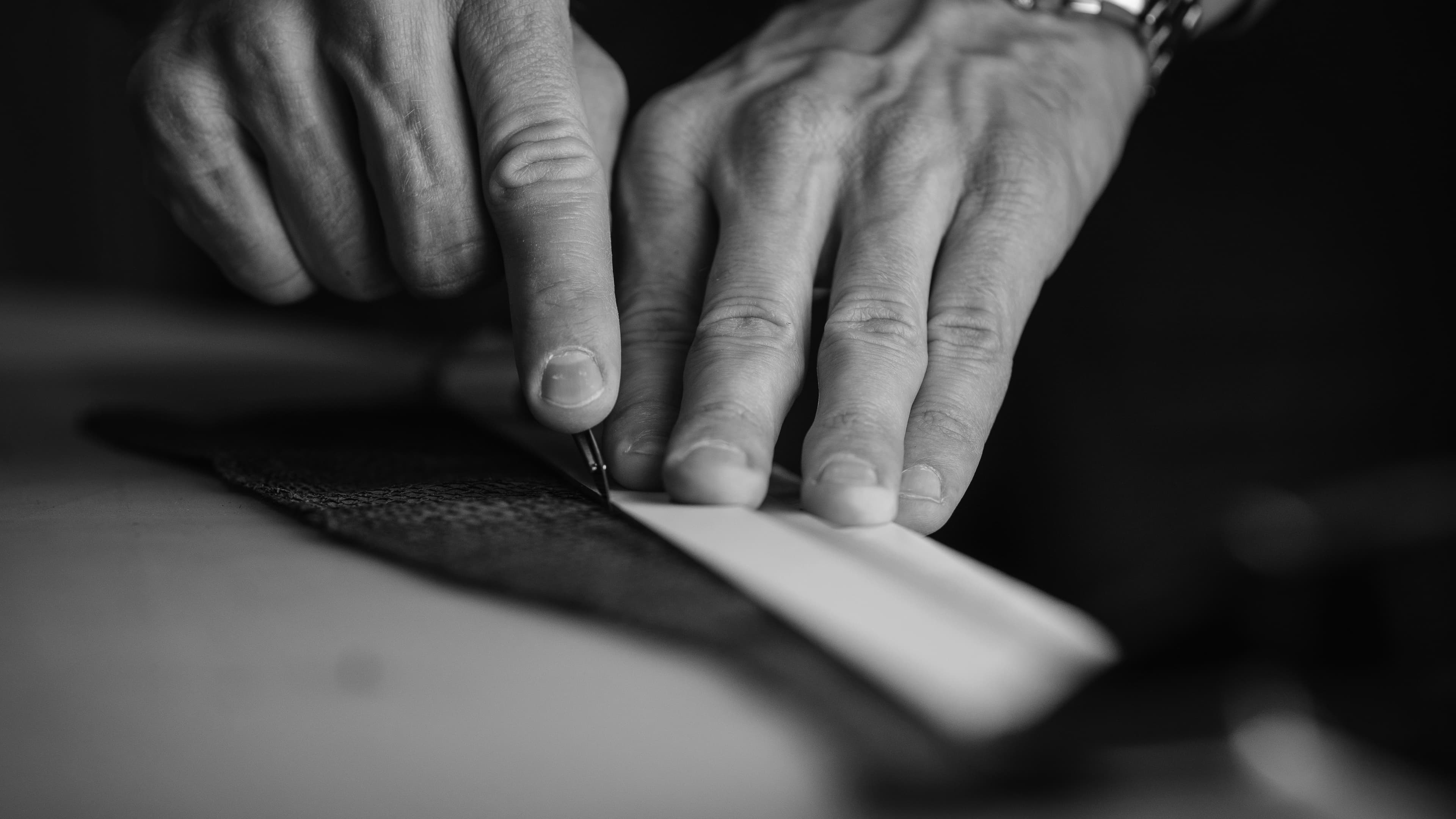 Behind the scenes image of designer working on materials