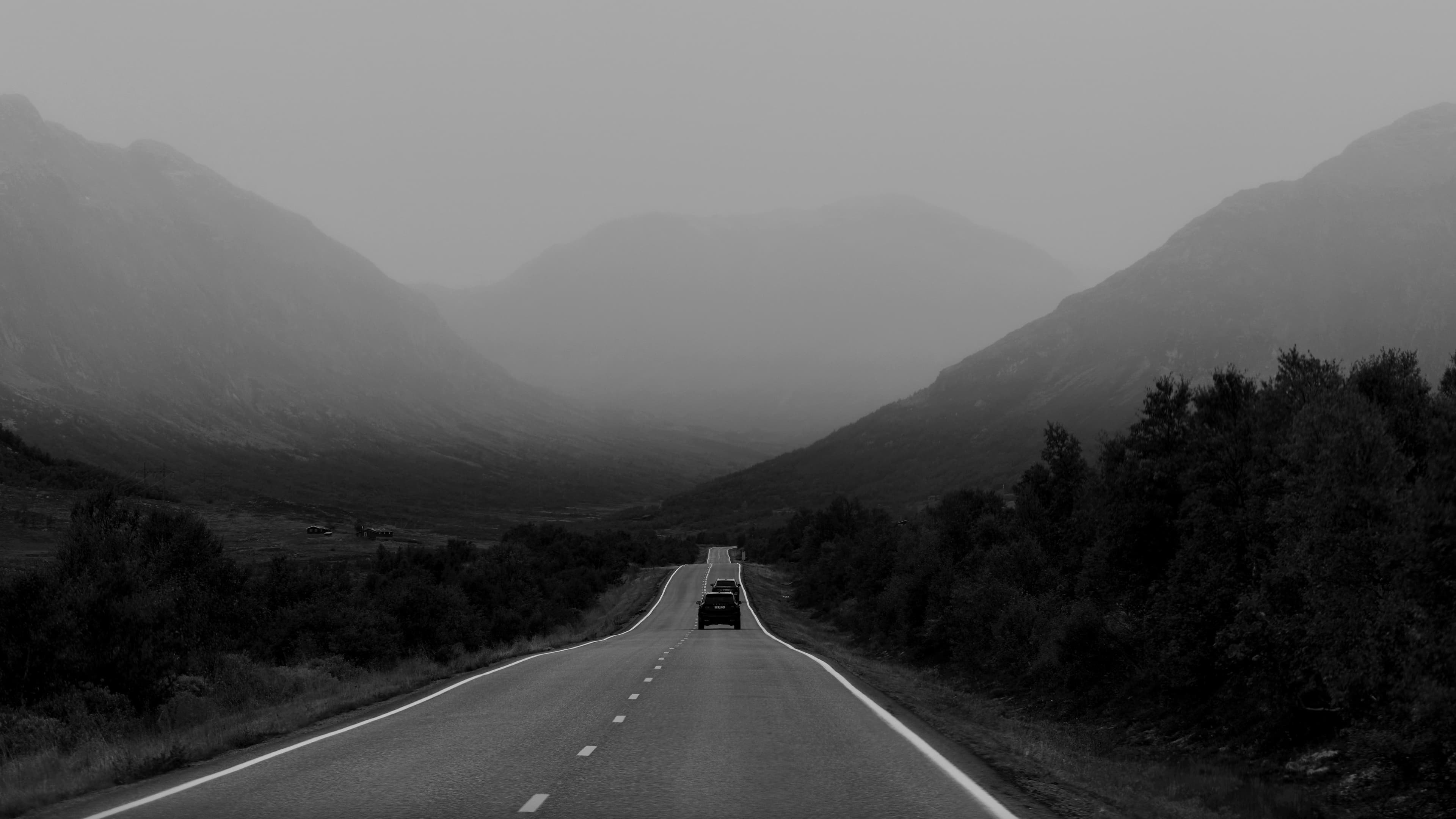 Landscape image of a road and Norwegian nature